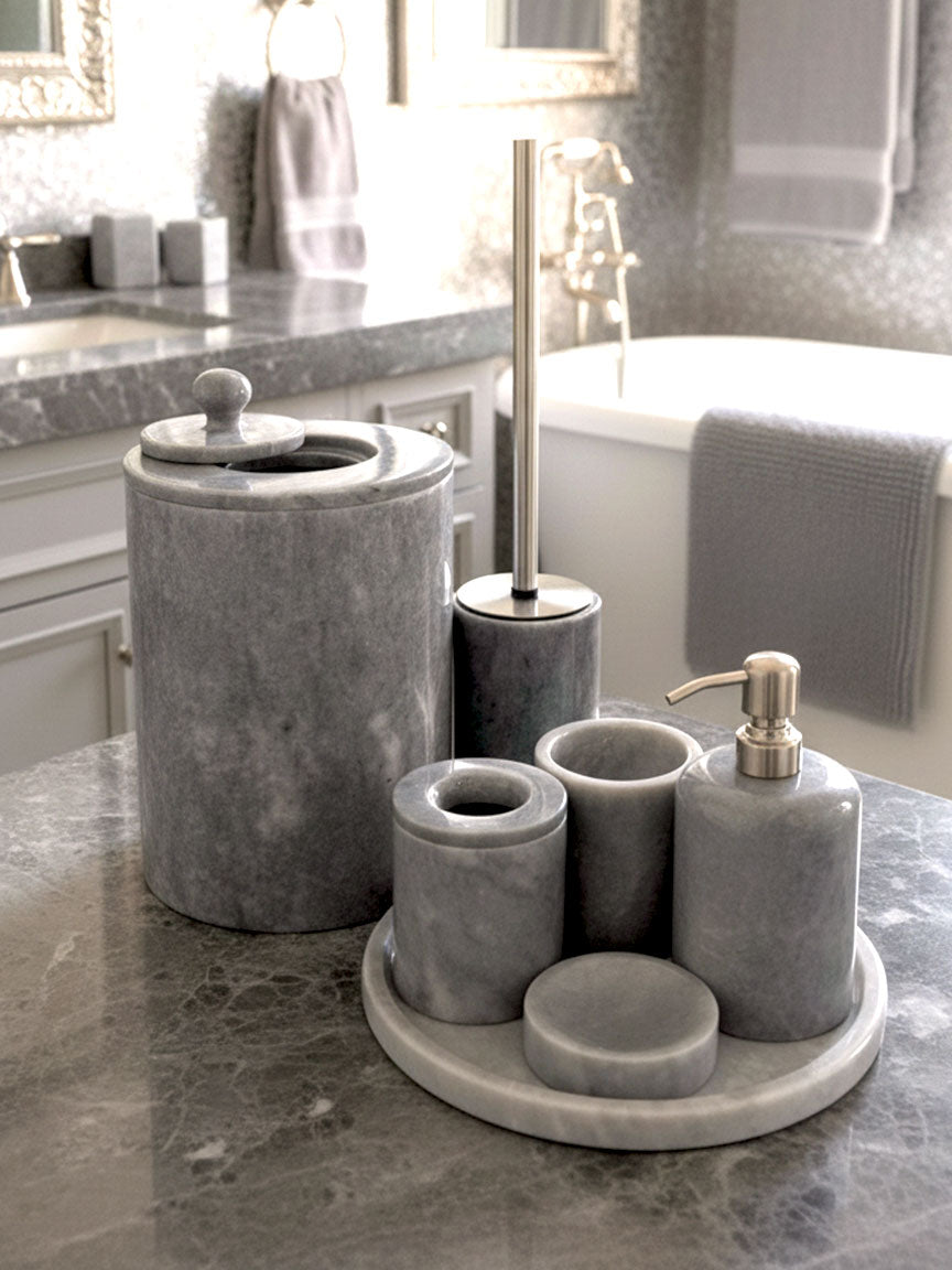 Luxury grey Afyon marble bathroom accessory set with gray accents displayed on a grey marble countertop, featuring lotion dispenser, cotton box, toothbrush holder, soap dish, tray, waste basket, and toilet brush — handcrafted Turkish marble décor by Creative Home Designs,BAS-KRYKK-AFYON-GRESil-S7,BAS-KRYKK-AFYON-GRESil-S5
