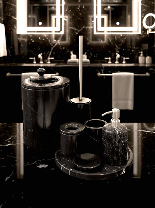 Luxury Toros black marble bathroom accessory set with silver accents displayed on a dark marble countertop, featuring lotion dispenser, cotton jar, toothbrush holder, soap dish, tray, waste basket, and toilet brush — handcrafted Turkish marble décor by Creative Home Designs,BAS-KRYKK-TOROS-BLASil-S7,BAS-KRYKK-TOROS-BLASil-S5