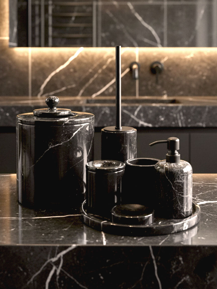 Luxury Toros black marble bathroom accessory set with silver accents displayed on a dark marble countertop, featuring lotion dispenser, cotton jar, toothbrush holder, soap dish, tray, waste basket, and toilet brush — handcrafted Turkish marble décor by Creative Home Designs,BAS-KRYKK-TOROS-BLABla-S7,BAS-KRYKK-TOROS-BLABla-S5
