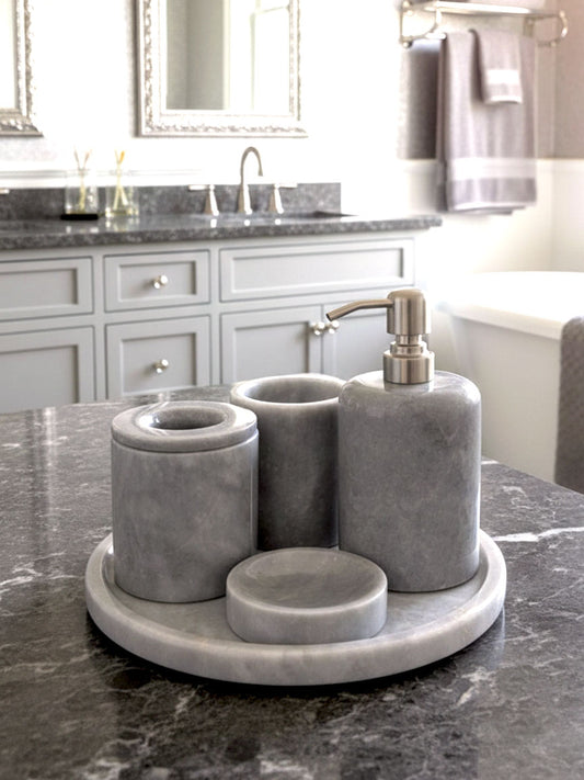 Luxury grey Afyon marble bathroom accessory set with gray accents displayed on a grey marble countertop, featuring lotion dispenser, cotton box, toothbrush holder, soap dish, tray, waste basket, and toilet brush — handcrafted Turkish marble décor by Creative Home Designs,BAS-KRYKK-AFYON-GRESil-S7,BAS-KRYKK-AFYON-GRESil-S5