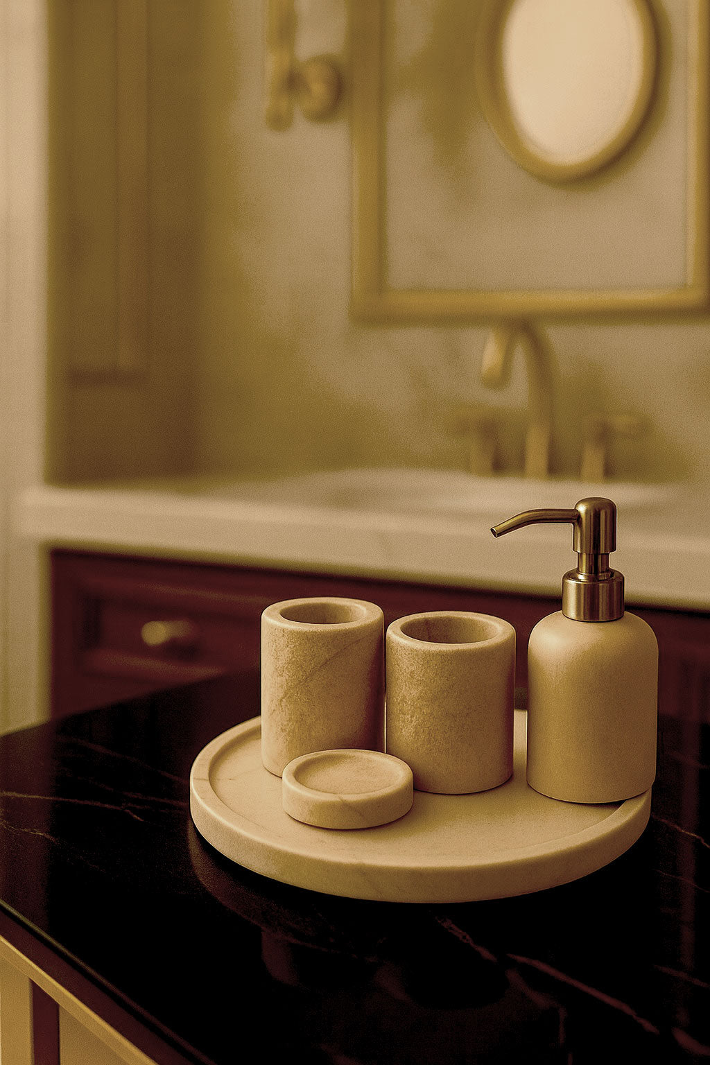 Luxury Toros beige gold marble bathroom accessory set with gold accents displayed on a dark marble countertop, featuring lotion dispenser, cotton jar, toothbrush holder, soap dish, tray, waste basket, and toilet brush — handcrafted Turkish marble décor by Creative Home Designs,BAS-KRYKK-TOROS-BEIGo-S5,BAS-KRYKK-TOROS-BEIGo-S7