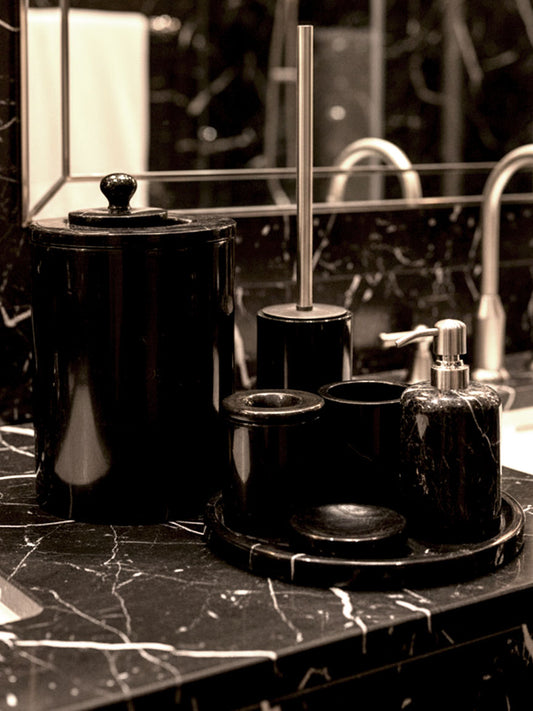 Luxury Toros black marble bathroom accessory set with silver accents displayed on a dark marble countertop, featuring lotion dispenser, cotton jar, toothbrush holder, soap dish, tray, waste basket, and toilet brush — handcrafted Turkish marble décor by Creative Home Designs,BAS-KRYKK-TOROS-BLASil-S7,BAS-KRYKK-TOROS-BLASil-S5