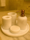 Luxury pearl white Afyon marble bathroom accessory set with copper accents displayed on a black marble countertop, featuring lotion dispenser, cotton box, toothbrush holder, soap dish, tray, waste basket, and toilet brush — handcrafted Turkish marble décor by Creative Home Designs,BAS-KRYKK-AFYON-PEARLCop-S7,BAS-KRYKK-AFYON-PEARLCop-S5