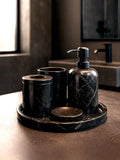 Luxury Toros black marble bathroom accessory set with silver accents displayed on a dark marble countertop, featuring lotion dispenser, cotton jar, toothbrush holder, soap dish, tray, waste basket, and toilet brush — handcrafted Turkish marble décor by Creative Home Designs,BAS-KRYKK-TOROS-BLABla-S7,BAS-KRYKK-TOROS-BLABla-S5