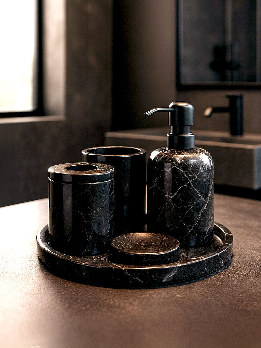 Luxury Toros black marble bathroom accessory set with silver accents displayed on a dark marble countertop, featuring lotion dispenser, cotton jar, toothbrush holder, soap dish, tray, waste basket, and toilet brush — handcrafted Turkish marble décor by Creative Home Designs,BAS-KRYKK-TOROS-BLABla-S7,BAS-KRYKK-TOROS-BLABla-S5