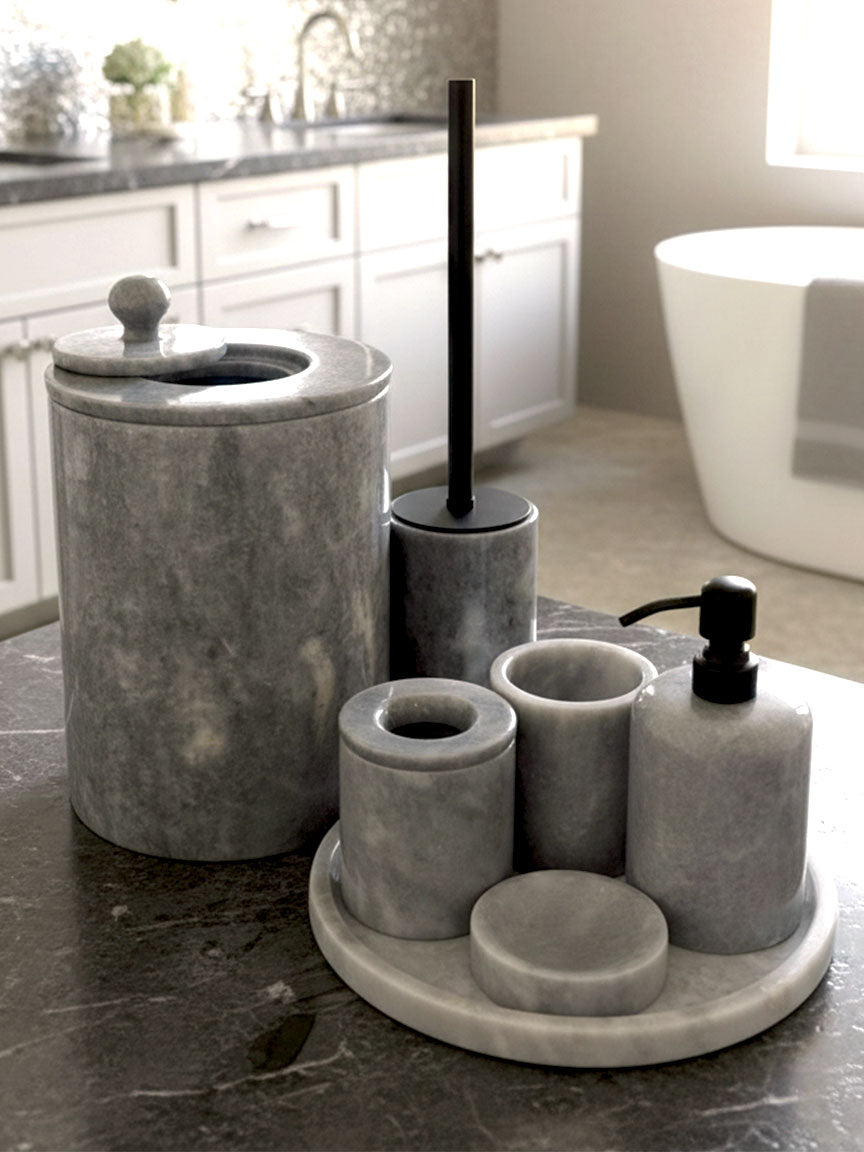 Luxury pearl white Afyon marble bathroom accessory set with gray accents displayed on a grey marble countertop, featuring lotion dispenser, cotton box, toothbrush holder, soap dish, tray, waste basket, and toilet brush — handcrafted Turkish marble décor by Creative Home Designs,BAS-KRYKK-AFYON-GREBla-S7,BAS-KRYKK-AFYON-GREBla-S5