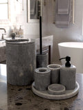 Luxury pearl white Afyon marble bathroom accessory set with gray accents displayed on a grey marble countertop, featuring lotion dispenser, cotton box, toothbrush holder, soap dish, tray, waste basket, and toilet brush — handcrafted Turkish marble décor by Creative Home Designs,BAS-KRYKK-AFYON-GREBla-S7,BAS-KRYKK-AFYON-GREBla-S5