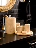 Luxury Toros beige gold marble bathroom accessory set with gold accents displayed on a dark marble countertop, featuring lotion dispenser, cotton jar, toothbrush holder, soap dish, tray, waste basket, and toilet brush — handcrafted Turkish marble décor by Creative Home Designs,BAS-KRYKK-TOROS-BEIBla-S7,BAS-KRYKK-TOROS-BEIBla-S5