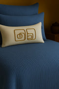 Luxury bedroom featuring a 100% muslin cotton Deep Blue gauze cloud blanket with matching pillows, styled on a bed beneath an arched window. BB-DesH-Blnkt-DeBlu-6070Price,BB-DesH-Blnkt-DeBlu-Tw,BB-DesH-Blnkt-DeBlu-Q,BB-DesH-Blnkt-DeBlu-K,BB-DesH-Blnkt-DeBlu-100118,BB-DesH-Blnkt-DeBlu-100125