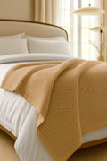Bedroom with a neatly made bed styled with a 100% Turkish cotton waffle blanket, showing its textured waffle weave and cozy bedcover look as throw blanket by Creative Home.BB-DesH-WaBlnkt-Latte-6070,BB-DesH-WaBlnkt-Latte-Tw,BB-DesH-WaBlnkt-Latte-Q,BB-DesH-WaBlnkt-Latte-K,BB-DesH-WaBlnkt-Latte-100118,BB-DesH-WaBlnkt-Latte-100125