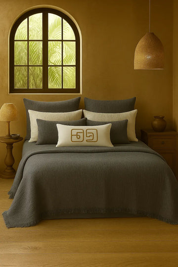 Luxury bedroom featuring a 100% muslin cotton gray gauze cloud blanket with matching pillows, styled on a bed beneath an arched window. BB-DesH-Blnkt-Gra-6070,BB-DesH-Blnkt-Gra-Tw, BB-DesH-Blnkt-Gra-Q,BB-DesH-Blnkt-Gra-K,BB-DesH-Blnkt-Gra-100118,BB-DesH-Blnkt-Gra-100125