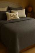 Luxury bedroom featuring a 100% muslin cotton gray gauze cloud blanket with matching pillows, styled on a bed beneath an arched window. BB-DesH-Blnkt-Gra-6070,BB-DesH-Blnkt-Gra-Tw, BB-DesH-Blnkt-Gra-Q,BB-DesH-Blnkt-Gra-K,BB-DesH-Blnkt-Gra-100118,BB-DesH-Blnkt-Gra-100125