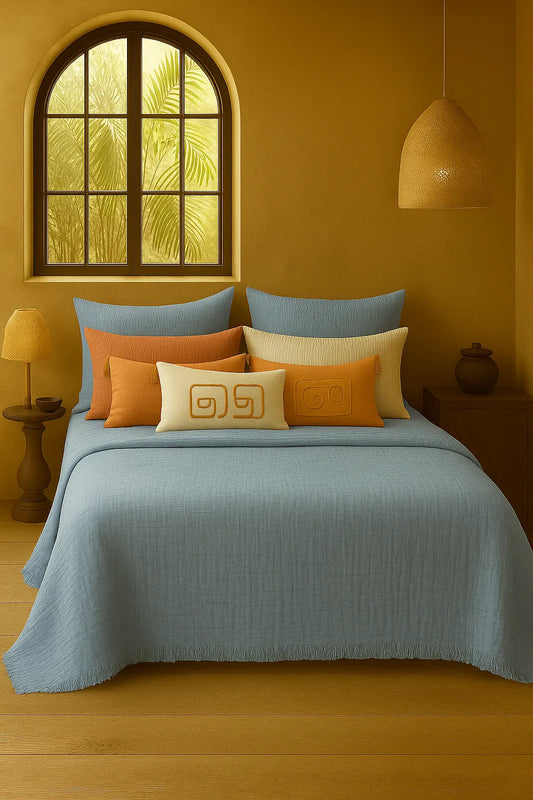 Luxury bedroom featuring a 100% muslin cotton Sky Blue gauze cloud blanket with matching pillows, styled on a bed beneath an arched window. BB-DesH-Blnkt-SkBlu-6070,BB-DesH-Blnkt-SkBlu-Tw,BB-DesH-Blnkt-SkBlu-Q,BB-DesH-Blnkt-SkBlu-K,BB-DesH-Blnkt-SkBlu-100118,BB-DesH-Blnkt-SkBlu-100125