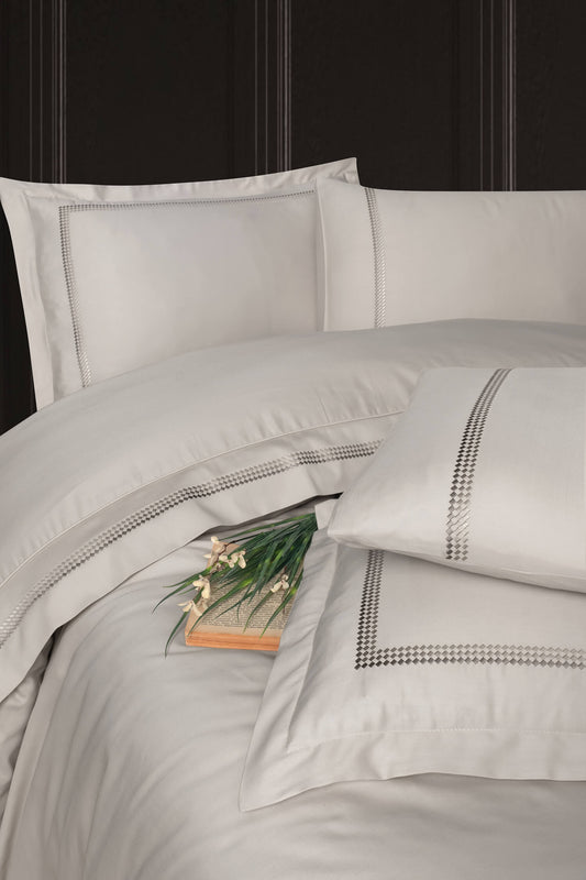 Creative Home Duvet Cover Set - Beige bedding set with embroidered details on a bed against a dark headboard. DC-FC-GOMEZ-Bei-Q,DC-FC-GOMEZ-Bei-K
