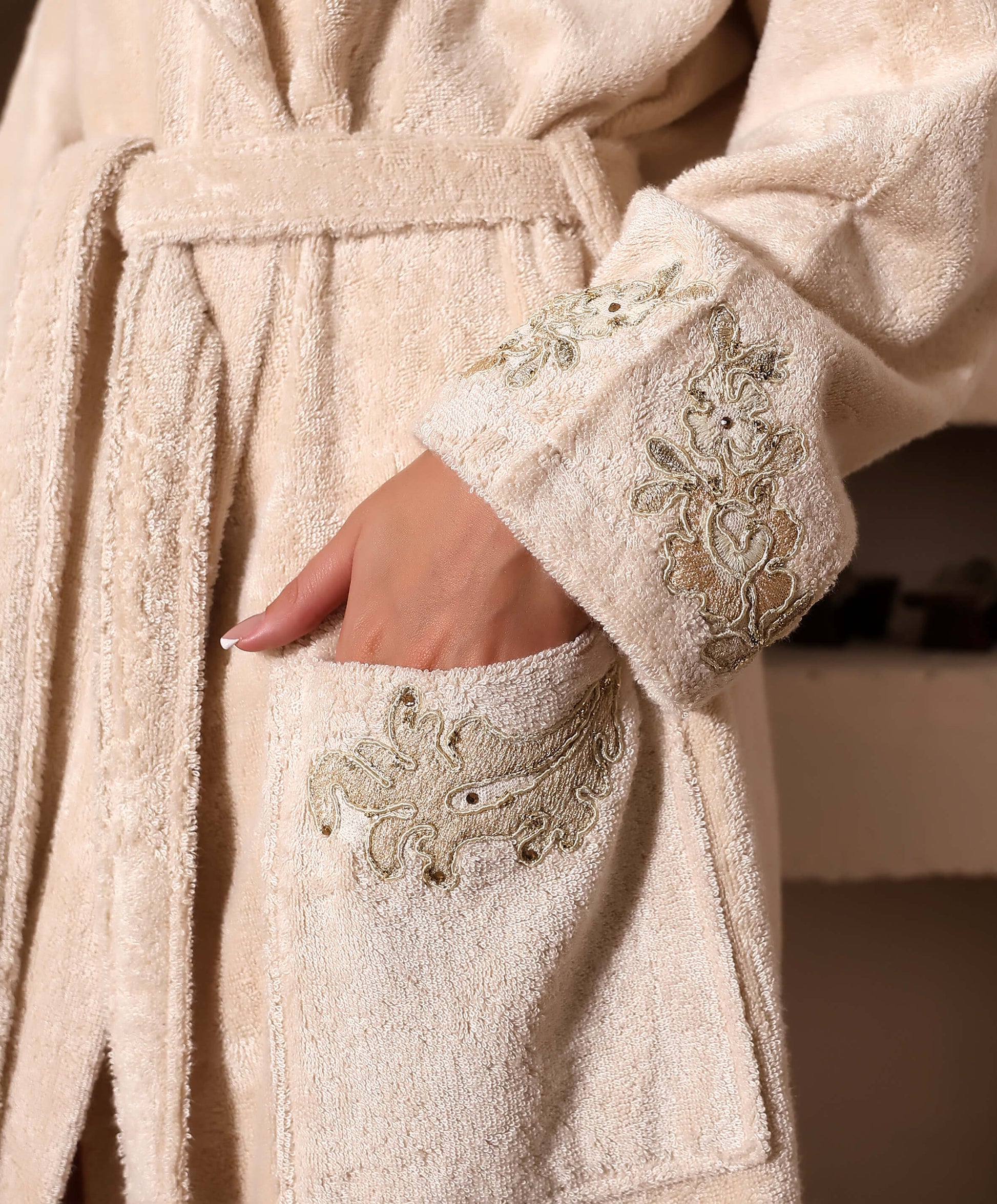 Woman wearing a beige Bamboo bathrobe by Creative Home, Gelin SPA Set with embroidery lace BRW-CH-GLNBei-Go-S-BO,BRW-CH-GLNBei-Go-S-BS,BRW-CH-GLNBei-Go-S-BST,BRW-CH-GLNBei-Go-M-BO,BRW-CH-GLNBei-Go-M-BS,BRW-CH-GLNBei-Go-M-BST,BRW-CH-GLNBei-Go-L-BO,BRW-CH-GLNBei-Go-L-BS,BRW-CH-GLNBei-Go-L-BST,BRW-CH-GLNBei-Go-XL-BO,BRW-CH-GLNBei-Go-XXL-BO,BRW-CH-GLNBei-Go-XXXL-BO,BRW-CH-GLNBei-Go-XL-BS,BRW-CH-GLNBei-Go-XXL-BS,BRW-CH-GLNBei-Go-XXXL-BS,BRW-CH-GLNBei-Go-XL-BST,BRW-CH-GLNBei-Go-XXL-BST,BRW-CH-GLNBei-Go-XXXL-BST