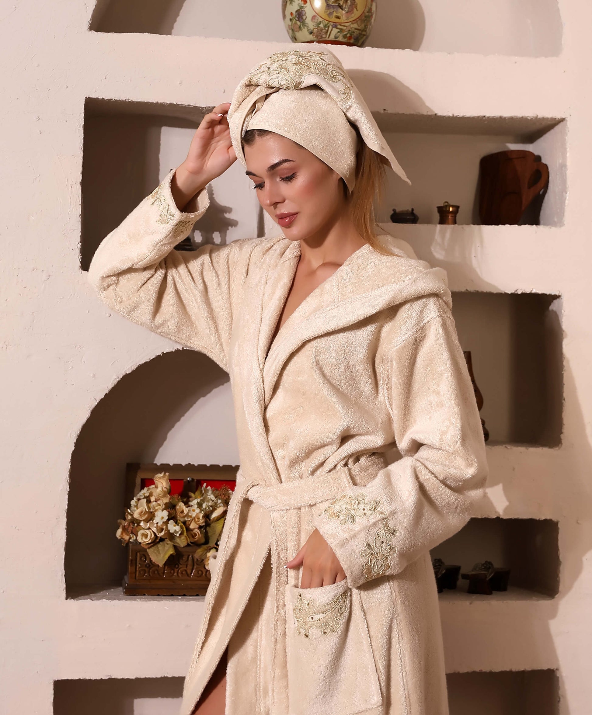 Woman wearing a beige Bamboo bathrobe by Creative Home, Gelin SPA Set with embroidery lace BRW-CH-GLNBei-Go-S-BO,BRW-CH-GLNBei-Go-S-BS,BRW-CH-GLNBei-Go-S-BST,BRW-CH-GLNBei-Go-M-BO,BRW-CH-GLNBei-Go-M-BS,BRW-CH-GLNBei-Go-M-BST,BRW-CH-GLNBei-Go-L-BO,BRW-CH-GLNBei-Go-L-BS,BRW-CH-GLNBei-Go-L-BST,BRW-CH-GLNBei-Go-XL-BO,BRW-CH-GLNBei-Go-XXL-BO,BRW-CH-GLNBei-Go-XXXL-BO,BRW-CH-GLNBei-Go-XL-BS,BRW-CH-GLNBei-Go-XXL-BS,BRW-CH-GLNBei-Go-XXXL-BS,BRW-CH-GLNBei-Go-XL-BST,BRW-CH-GLNBei-Go-XXL-BST,BRW-CH-GLNBei-Go-XXXL-BST