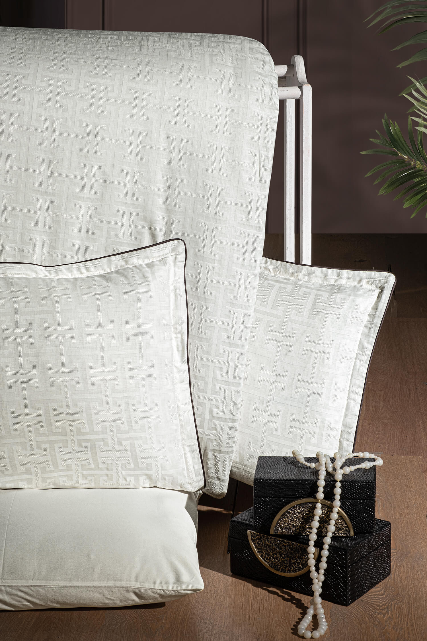 Creative Home Duvet Cover Set - Cream Jacquard Luxury Pattern Bedding set on a bed with a dark wall and small table in the background, DC-FC-RODEL-Cr-Q,DC-FC-RODEL-Cr-K