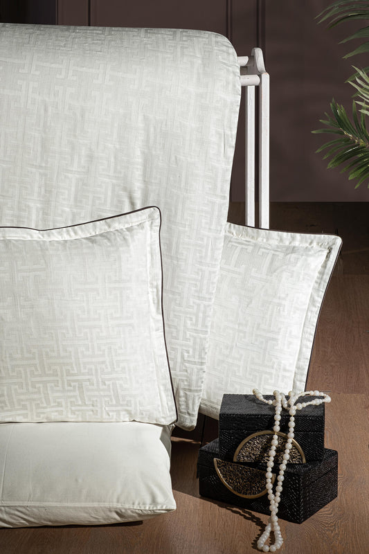 Creative Home Duvet Cover Set - Cream Jacquard Luxury Pattern Bedding set on a bed with a dark wall and small table in the background, DC-FC-RODEL-Cr-Q,DC-FC-RODEL-Cr-K