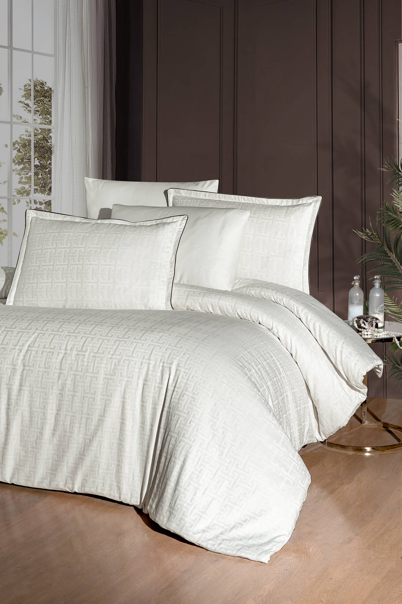 Creative Home Duvet Cover Set - Cream Jacquard Luxury Pattern Bedding set on a bed with a dark wall and small table in the background, DC-FC-RODEL-Cr-Q,DC-FC-RODEL-Cr-K