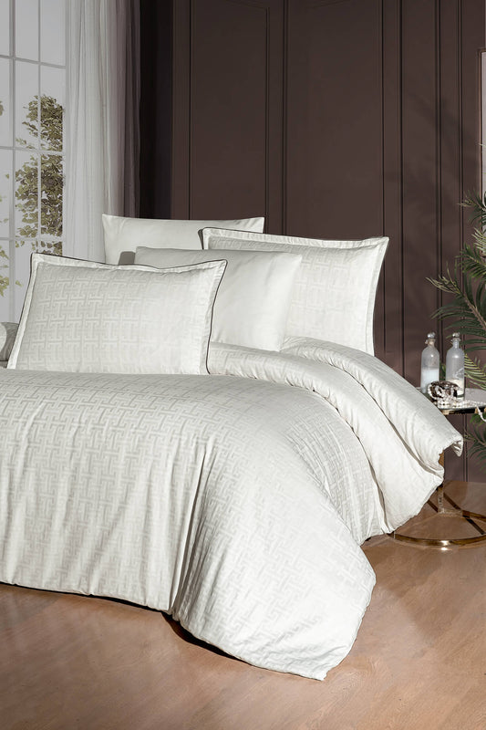 Creative Home Duvet Cover Set - Cream Jacquard Luxury Pattern Bedding set on a bed with a dark wall and small table in the background, DC-FC-RODEL-Cr-Q,DC-FC-RODEL-Cr-K